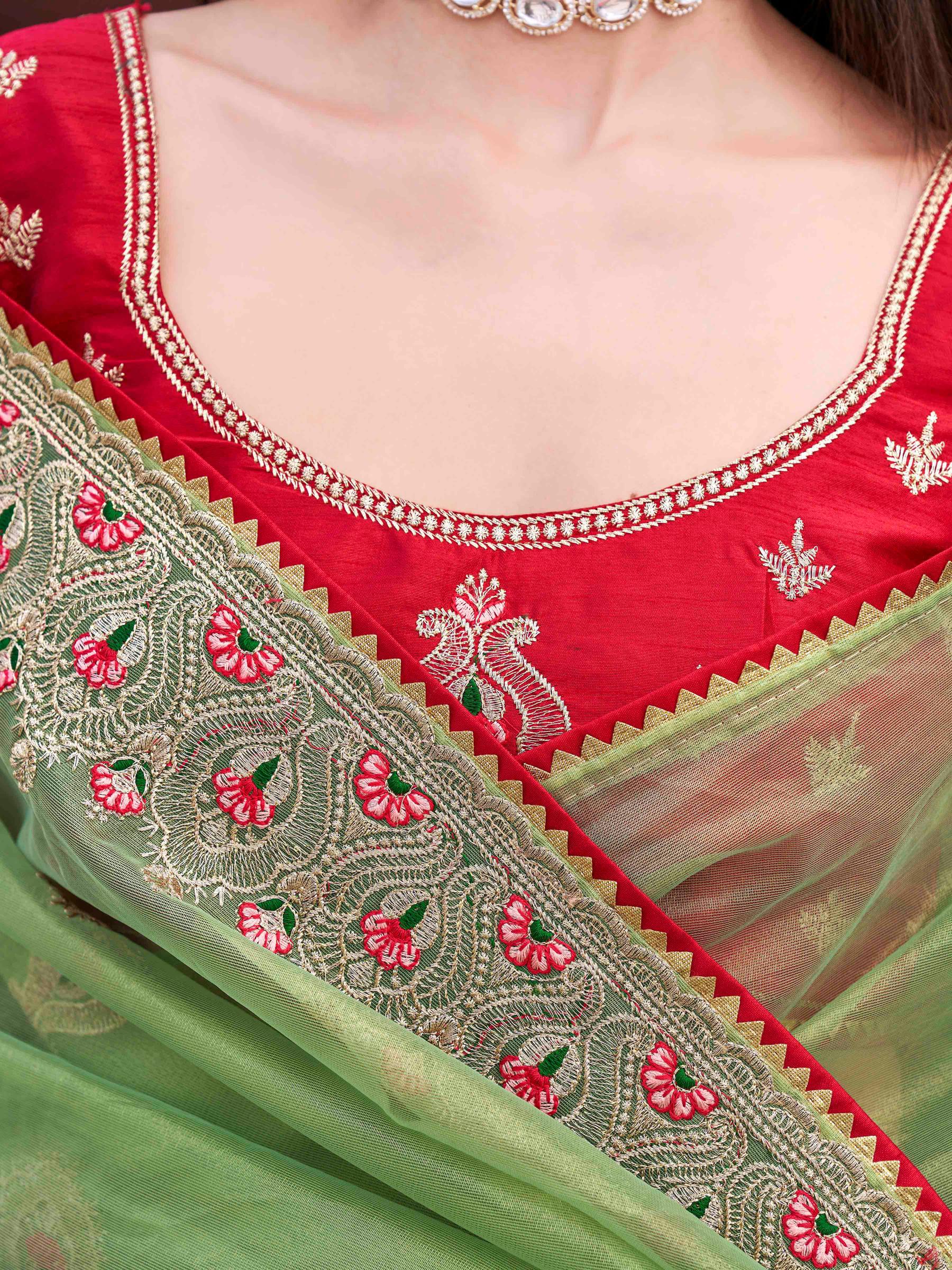 Green colored shimmer net embroidered saree